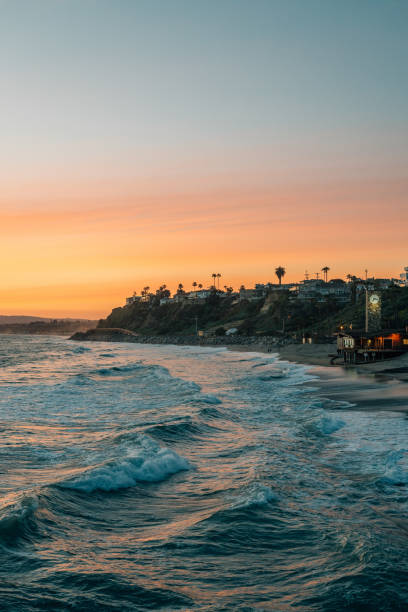 istock Waves in the Pacific Ocean and cliffs along the beach at sunset, in San Clemente, Orange County, California 1284237206