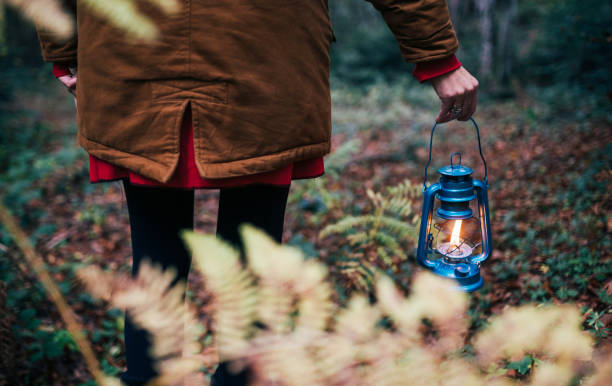 istock Woman Walking With An Old Blue Lantern In Her Hand 1284237355