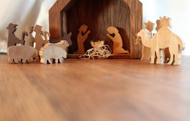 christmas nativity scene christmas holiday nativity scene background with wood figurines manger animals and baby in a rustic wood setting shepherd sheep lamb bible stock pictures, royalty-free photos & images