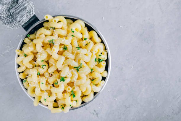 istock American mac and cheese, macaroni and cheese pasta in pan 1284240050