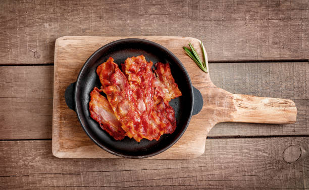 istock Tasty fried crispy bacon slices 1284240215