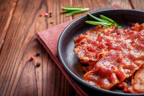 istock Tasty fried crispy bacon slices 1284240218