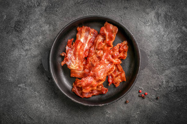 istock Tasty fried crispy bacon slices 1284240237