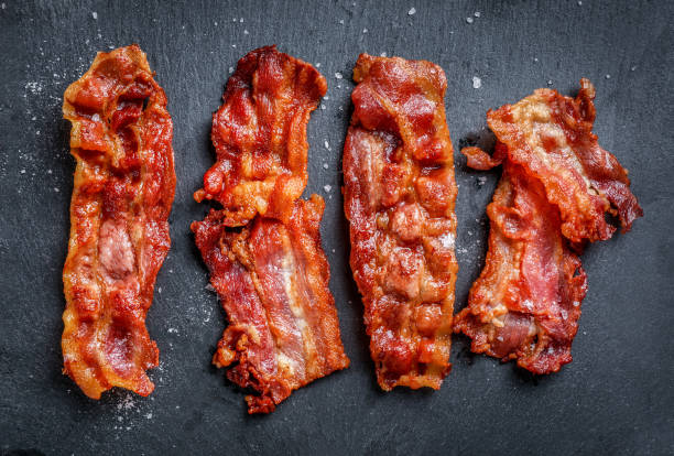 istock Tasty fried crispy bacon slices 1284240249