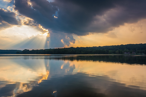Sunset reflecting in Pinchot Lake, at Gifford Pinchot State Park, Pennsylvania.