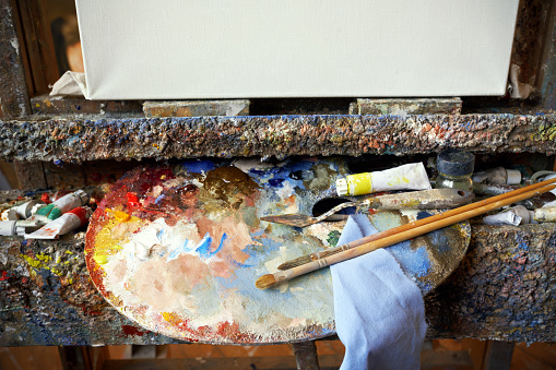 Artist's palette and primed canvas in the studio