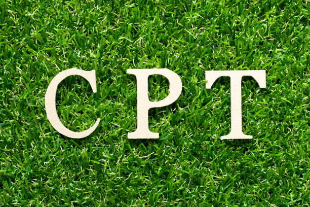 istock Wood alphabet letter in word CPT (Abbreviation of Carriage Paid To) on green grass background 1284243834