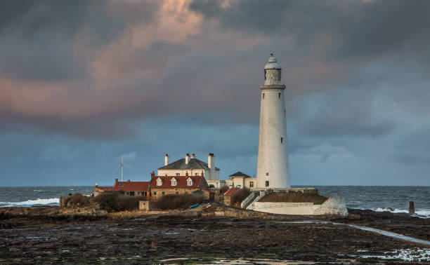 istock Big Clouds over St. Mary's Lighthouse at low tide (1) 1284244832