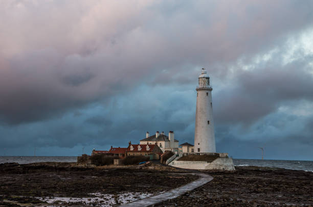 istock Big Clouds over St. Mary's Lighthouse at low tide (2) 1284244833
