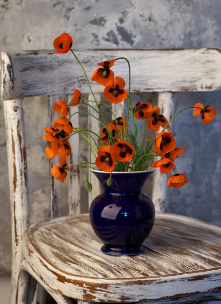 A Little Red Poppies Bouquet Arranged In Classical Style