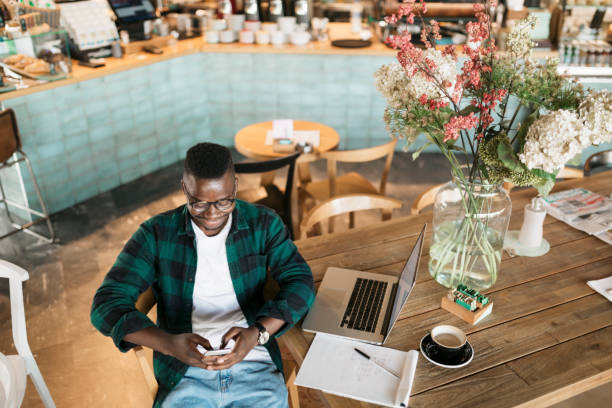 istock High angle view of a handsome African American male student working 1284246029