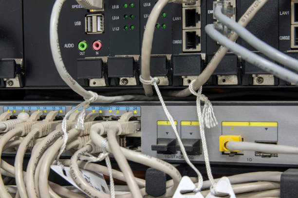 istock Fiber optic cables connected to the data center. Indicators are on, data transfer is in progress. Computer equipment. Selective focus. 1284247388