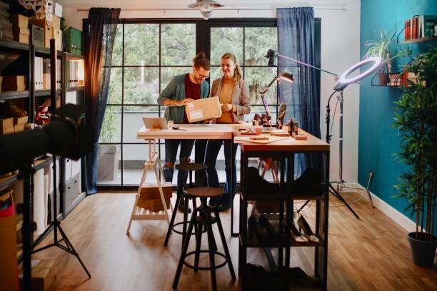 istock Small business owners packing packages and using adhesive tape 1284248691