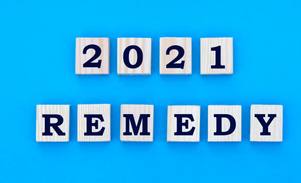 istock concept word 2021 REMEDY on cubes on a blue background 1284250935