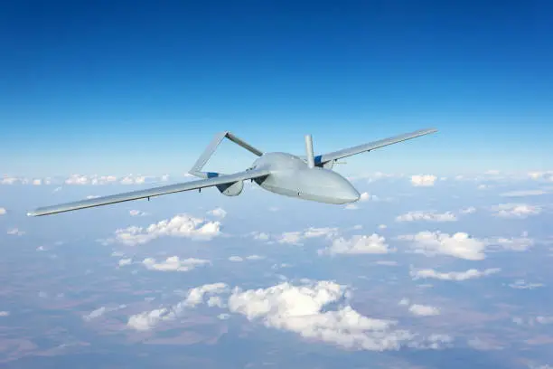 Unmanned military drone uav flying reconnaissance in the air high in the sky in the border areas