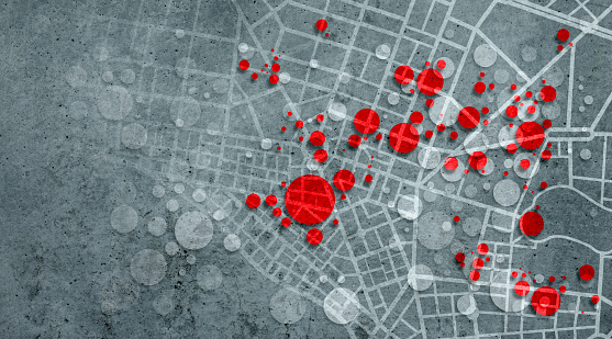 Pandemic clusters background on city map showing red circles overlapping on a dark textured background with copy space