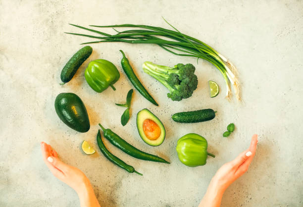 istock Crop woman with fresh vegetables on table 1284253136