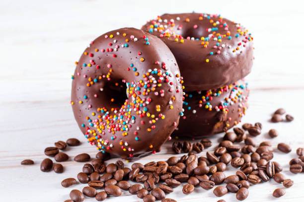 istock Chocolate gluten free donuts with coffee on a table 1284253153
