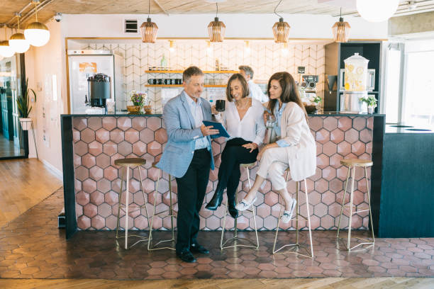 istock Colleagues having a meeting in a cafe 1284253212