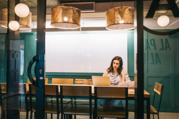 istock Businesswoman working late hours at the office 1284253264