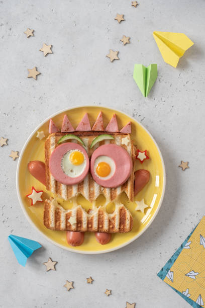 istock Monster sandwich with sausage, eggs and cheese on plate. 1284254305