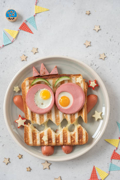 istock Monster sandwich with sausage, eggs and cheese on plate. 1284254338
