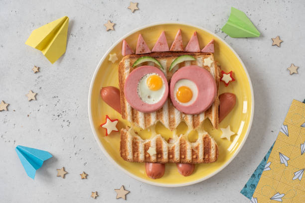 istock Monster sandwich with sausage, eggs and cheese on plate. 1284254527