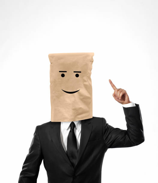 istock Happy bussinesman with paper bag on his head 1284256978