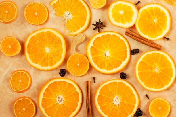 istock Round orange slices and mulled wine seasoning, warm background. 1284257072