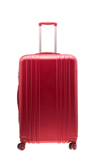 red suitcase isolated stock photo