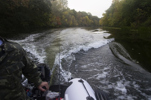 Ride on an inflatable boat on the autumn river
