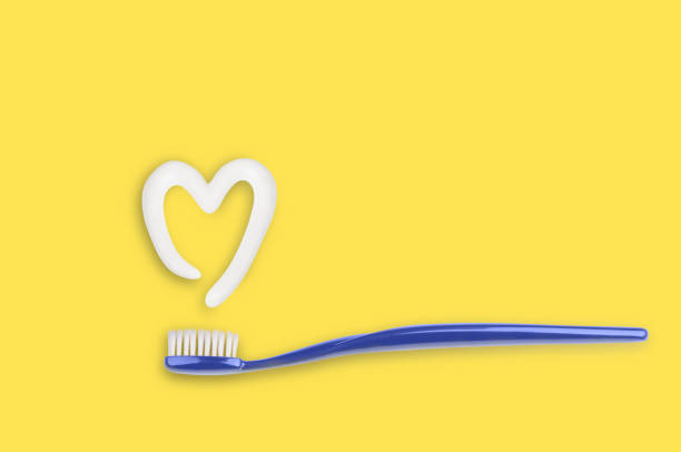 istock Blue toothbrush and  toothpaste in shape of heart 1284259950