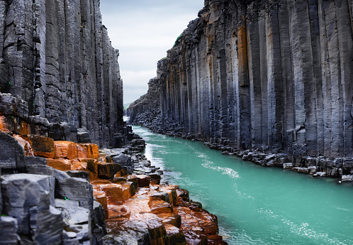 Studlagil basalt canyon in Iceland. Most famous and popular place in Iceland. Large panoramic view. River in canyon.