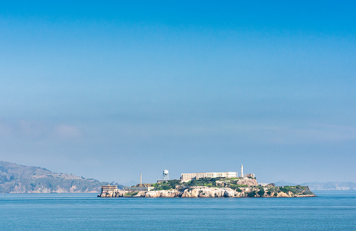 Alcatraz Island, famously the location for the iconic prison, as well as a lighthouse and other federal structures, located off the San Francisco coast in California.