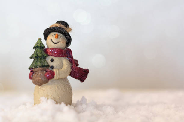 istock Snowman figure on snow with blurred background with copy space 1284263483
