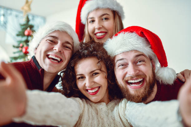 istock Cute Christmas Selfie By Smiling Friends 1284263873