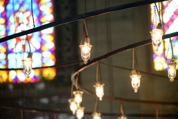 spotlights inside the blue mosque in istanbul turkey - sultan ahmed mosque imagens e fotografias de stock