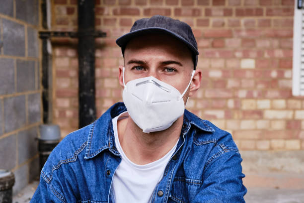 istock Young Man Wearing A Face Mask 1284264968