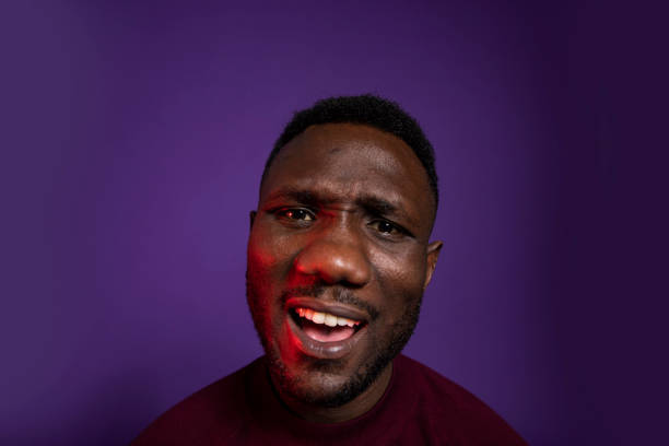istock Head Shot of Young Black Man with Surprised Facial Expression 1284265421
