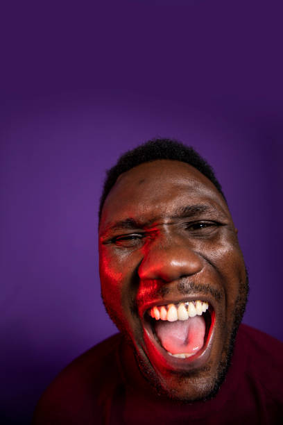 istock Face of African Man Screaming with Mouth Open 1284265458