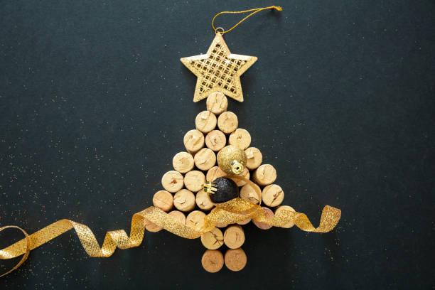 istock Wine corks christmas tree, festive decoration, black background 1284266065