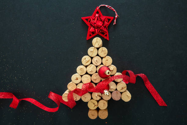 istock Wine corks christmas tree, festive decoration, black background 1284266071