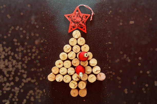 istock Wine corks christmas tree, festive decoration, bokeh background 1284266072