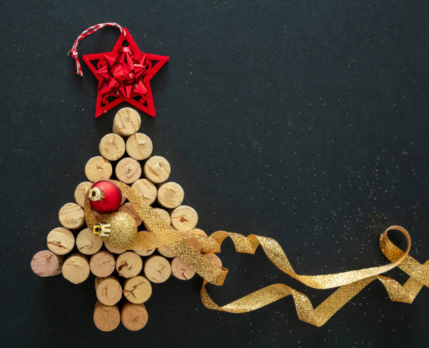 istock Wine corks christmas tree, festive decoration, black background 1284266073