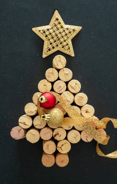 istock Wine corks christmas tree, festive decoration, black background 1284266078