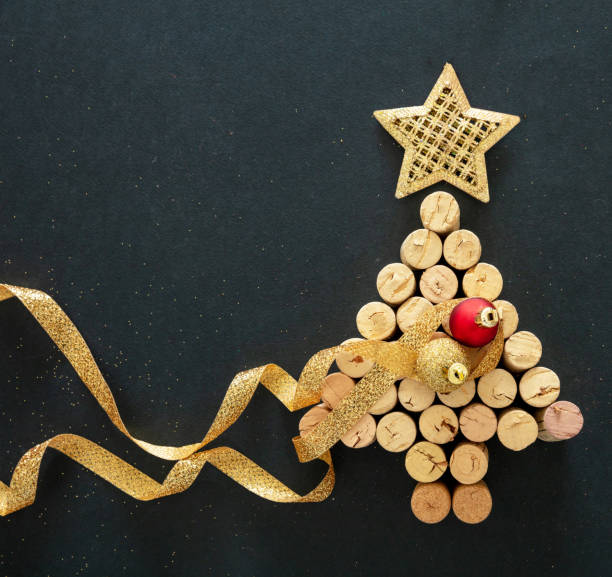 istock Wine corks christmas tree, festive decoration, black background 1284266080
