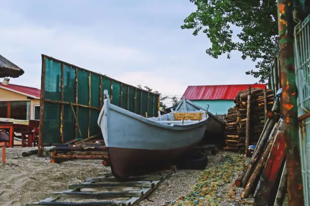 Traditional fishing boat on the Olimp beach in Romania.