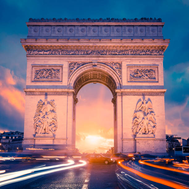 istock View of famous Arc de Triomphe at sunset 1284273777