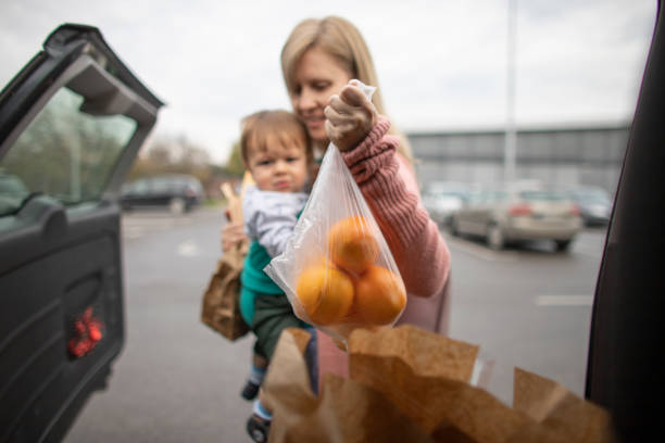 istock Mother with baby in shopping 1284279089