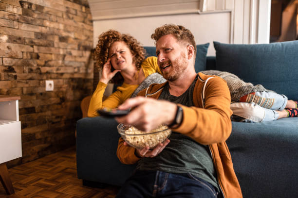 istock Disgusted young couple watching a movie. 1284279357